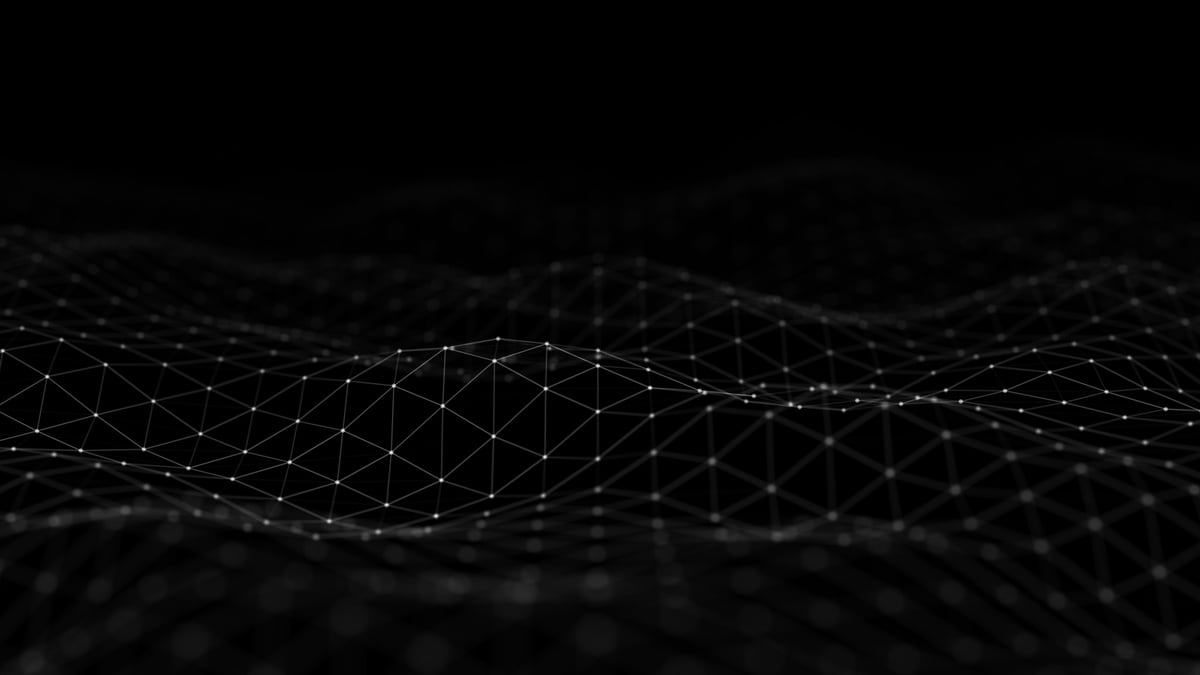 Digital wireframe mesh surface with glowing connection points