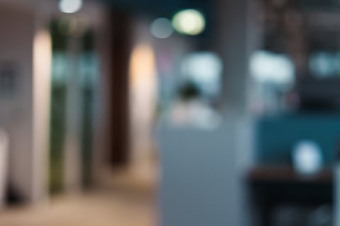 Office interior bokeh blur background. Modern workplace atmosphere abstract defocused scene.